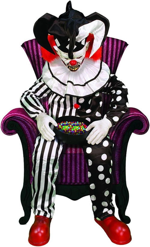 Sitting Scare Clown animatronic dozing in a chair with a full candy bowl